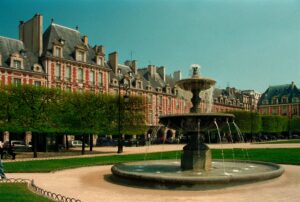 In the Marais district of Paris, photo of the Place des Vosges and one of its beautiful fountains.